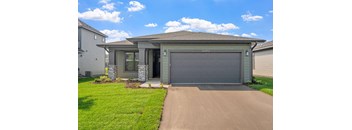 a house with a driveway and a garage door