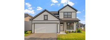 a white and gray house with a garage door