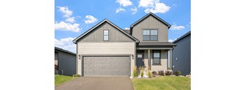 a house with a garage door in front of it