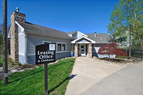 a building with a leasing office sign in front of it