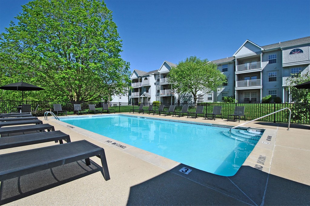 the preserve at ballantyne commons resort style swimming pool with benches and apartment buildings