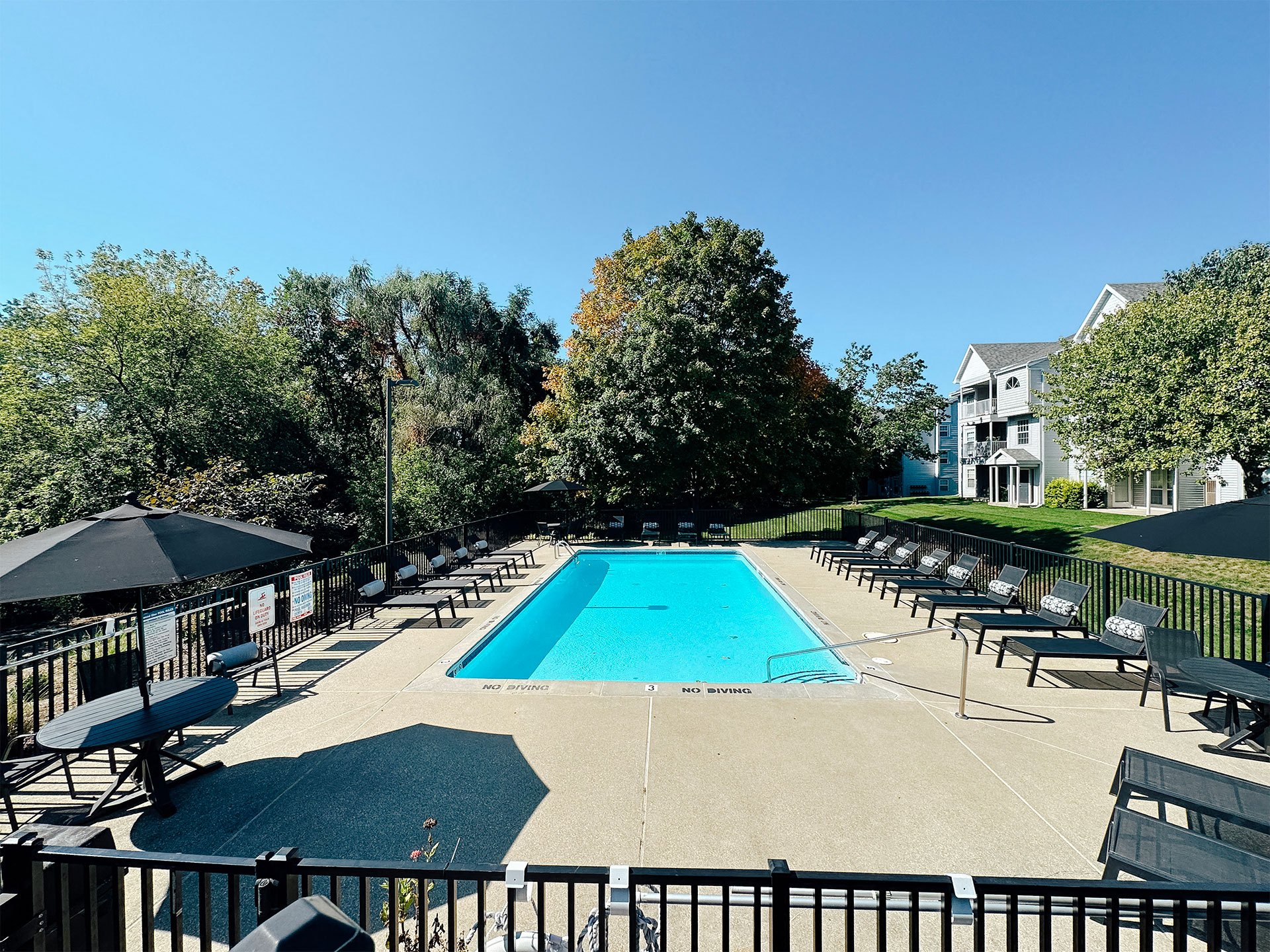 outdoor swimming pool with lounge chairs
