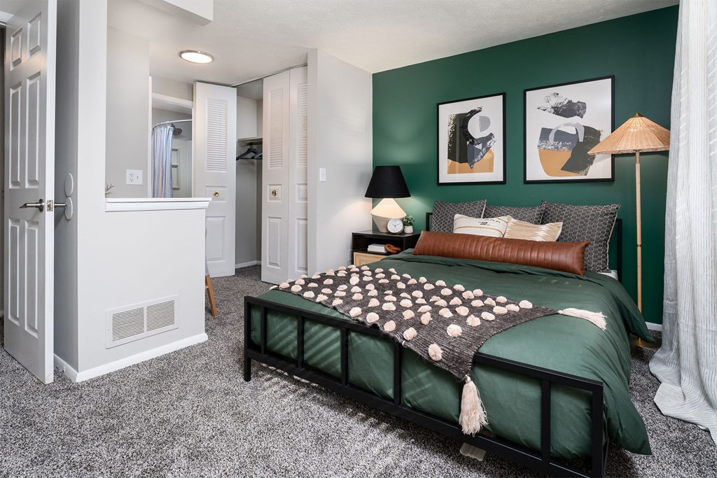 bedroom with a large bed and a closet