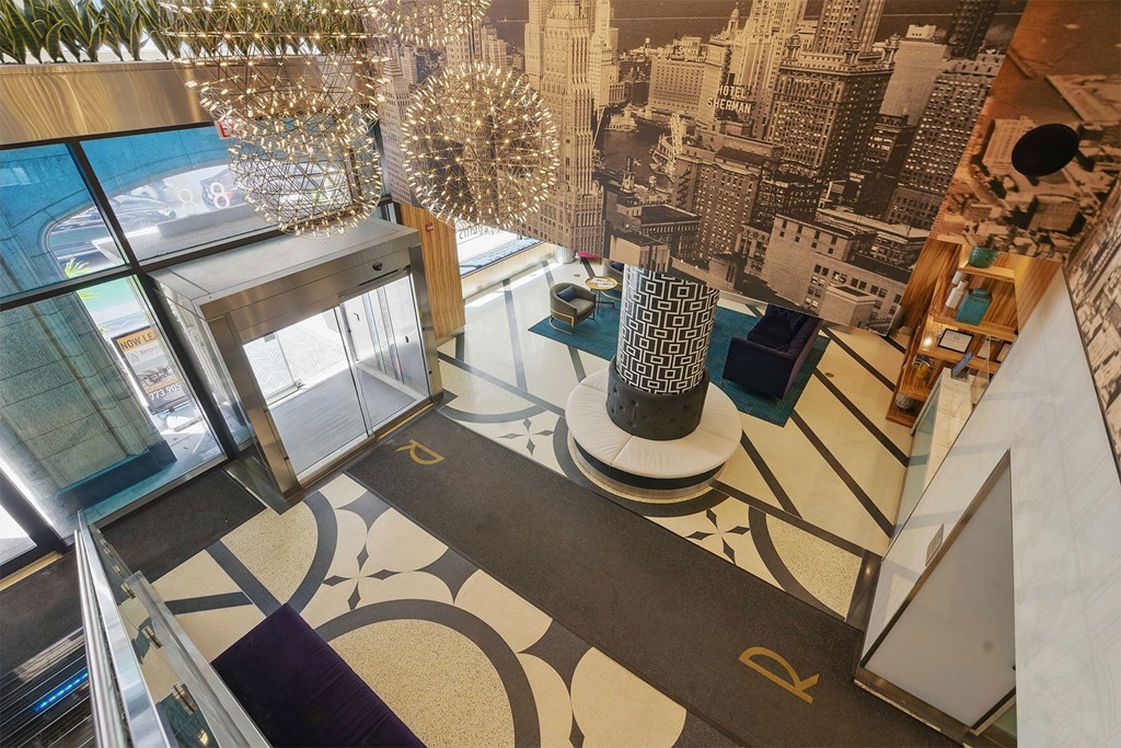 A staircase with a black and white patterned floor.