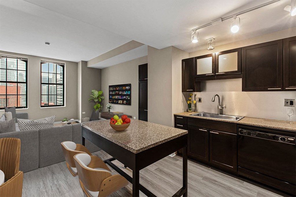a kitchen and living room with a table