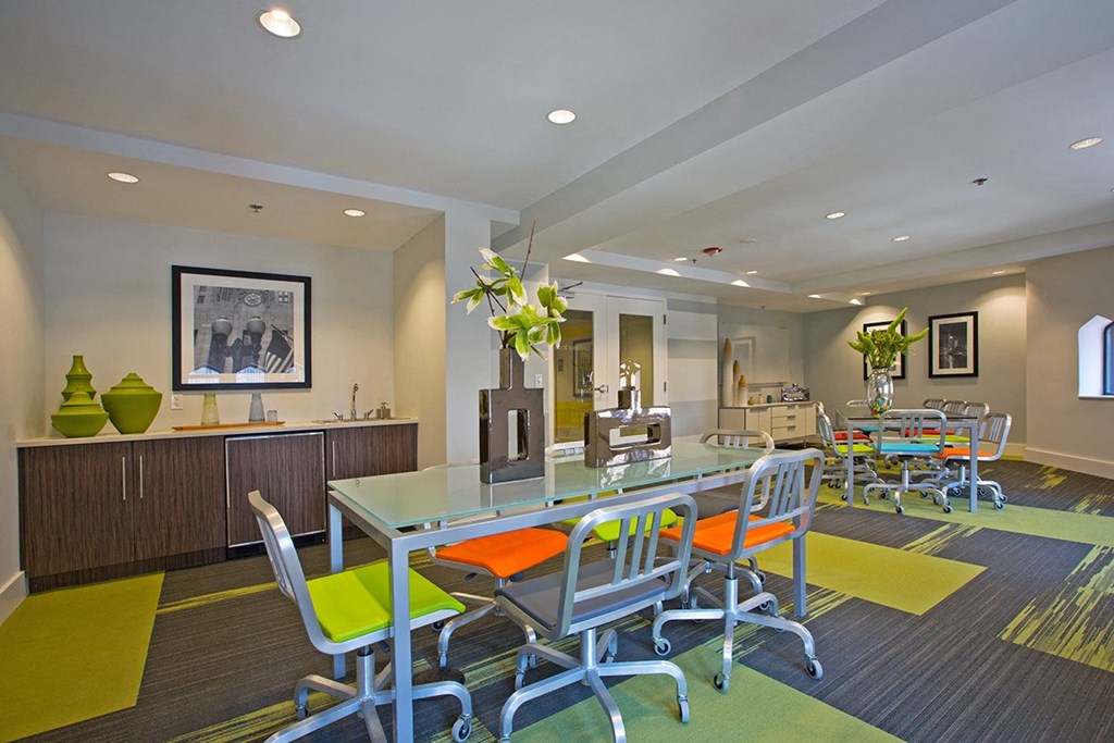 a conference room with a glass table and chairs