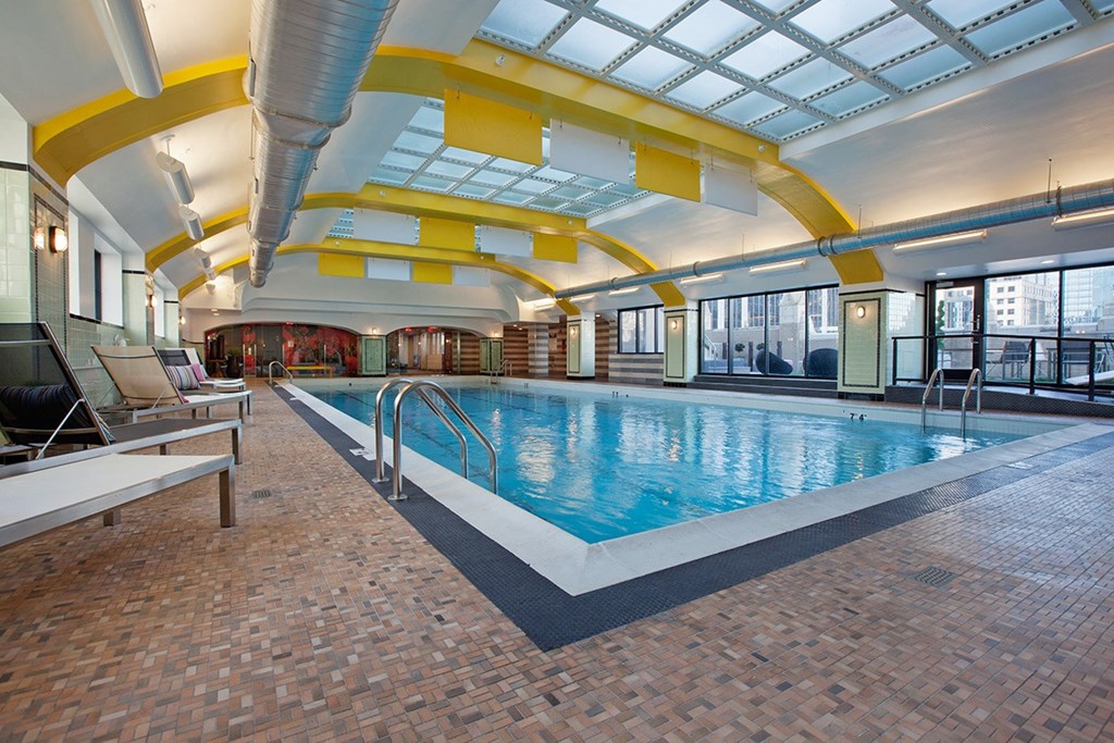 a swimming pool at a hotel with a glass ceiling