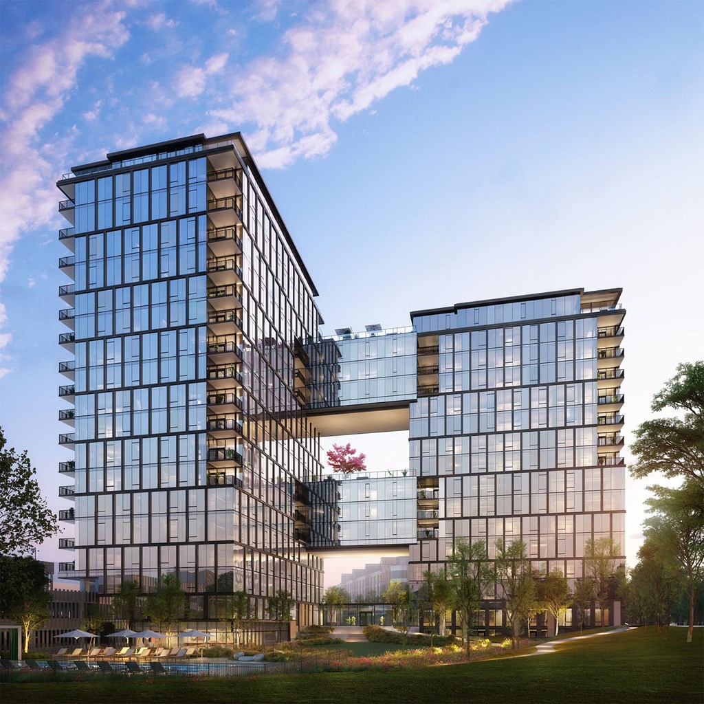 a rendering of a tall building with a park in front of it