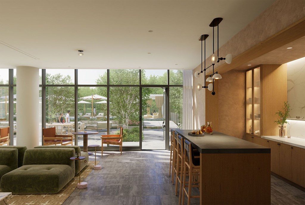 the kitchen and living room of a modern house with large glass doors