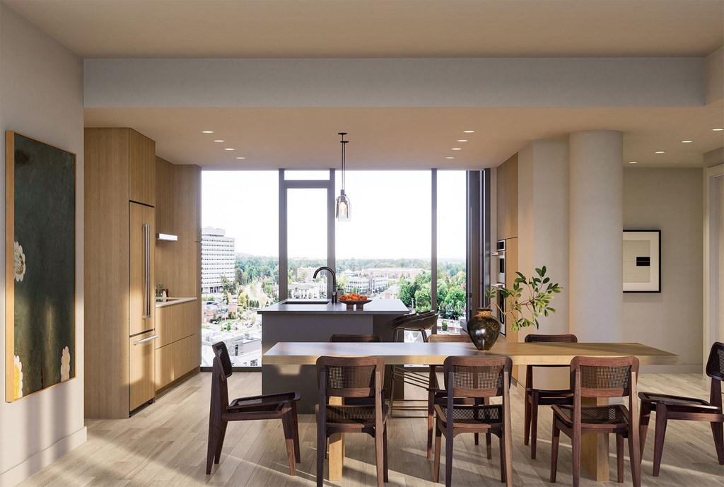 a kitchen and dining room with a table and chairs
