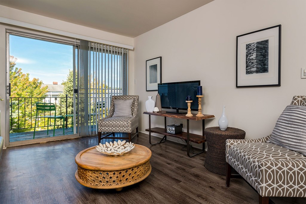 A living room with a sofa, chair, and coffee table.