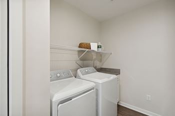 A laundry room with a washer and dryer.