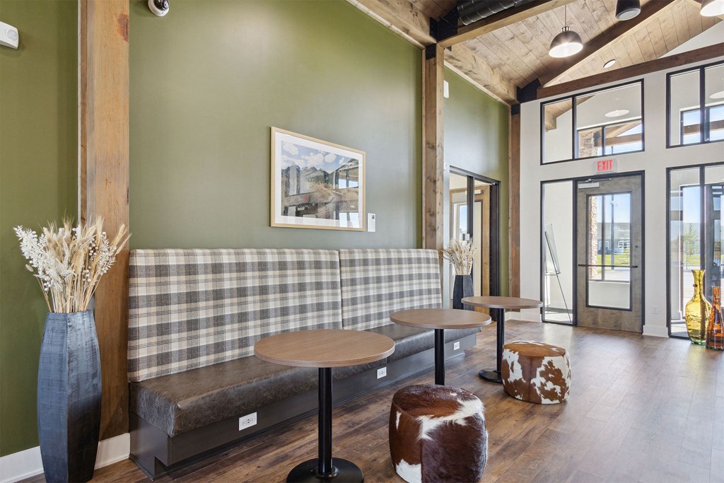 a living room with a couch and tables