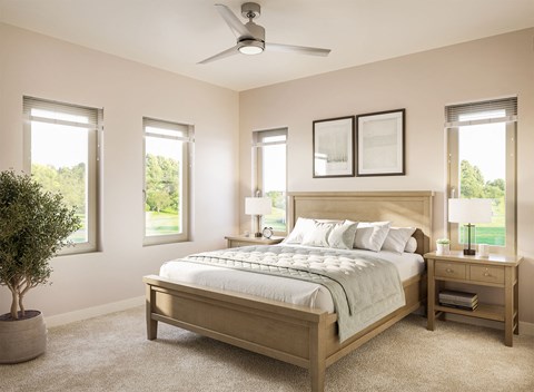a bedroom with a bed and a ceiling fan