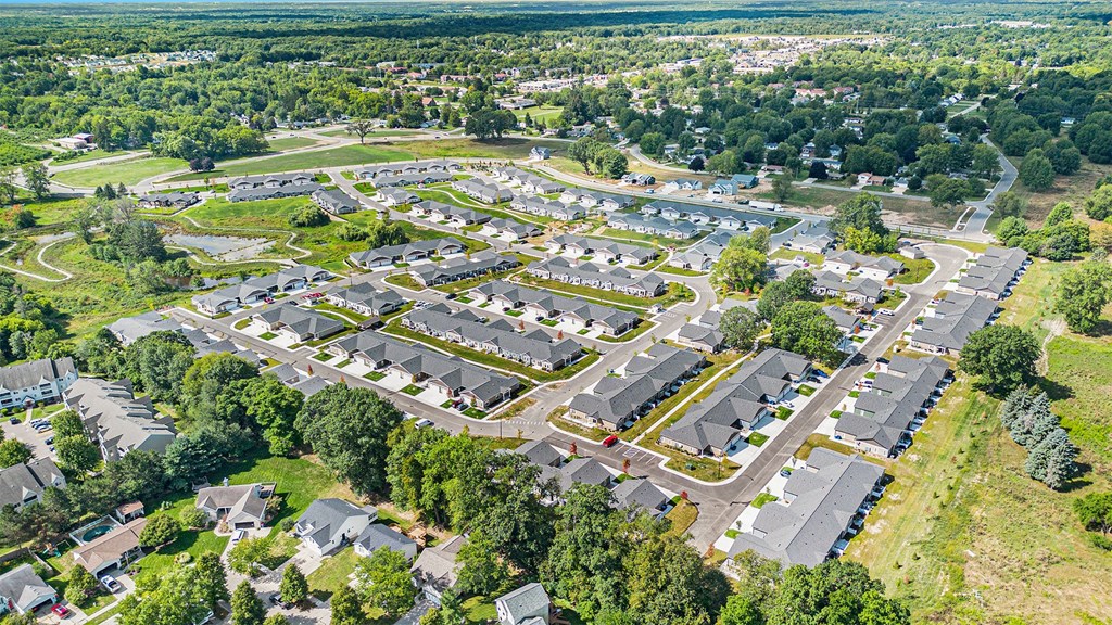 A bird's eye view of a residential area with houses and trees.
