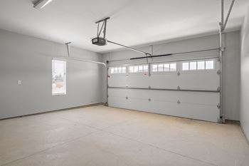 the interior of a garage with a white door