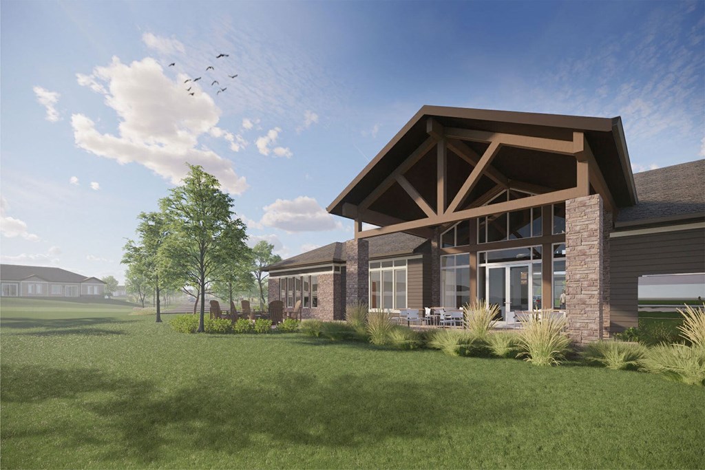 a rendering of the exterior of a building with grass and trees