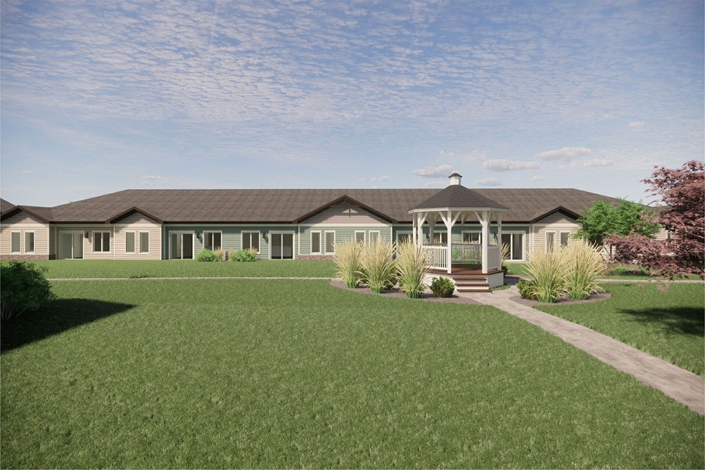 a home with a lawn and a gazebo