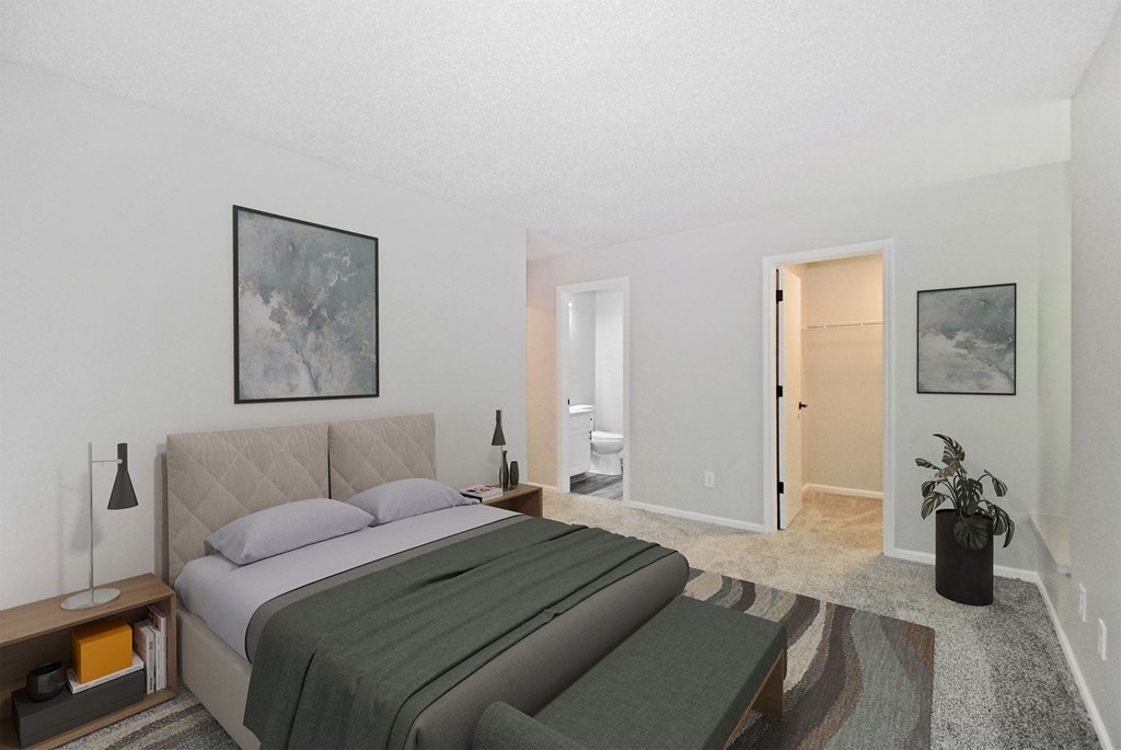 A bedroom with a large bed and a painting on the wall.