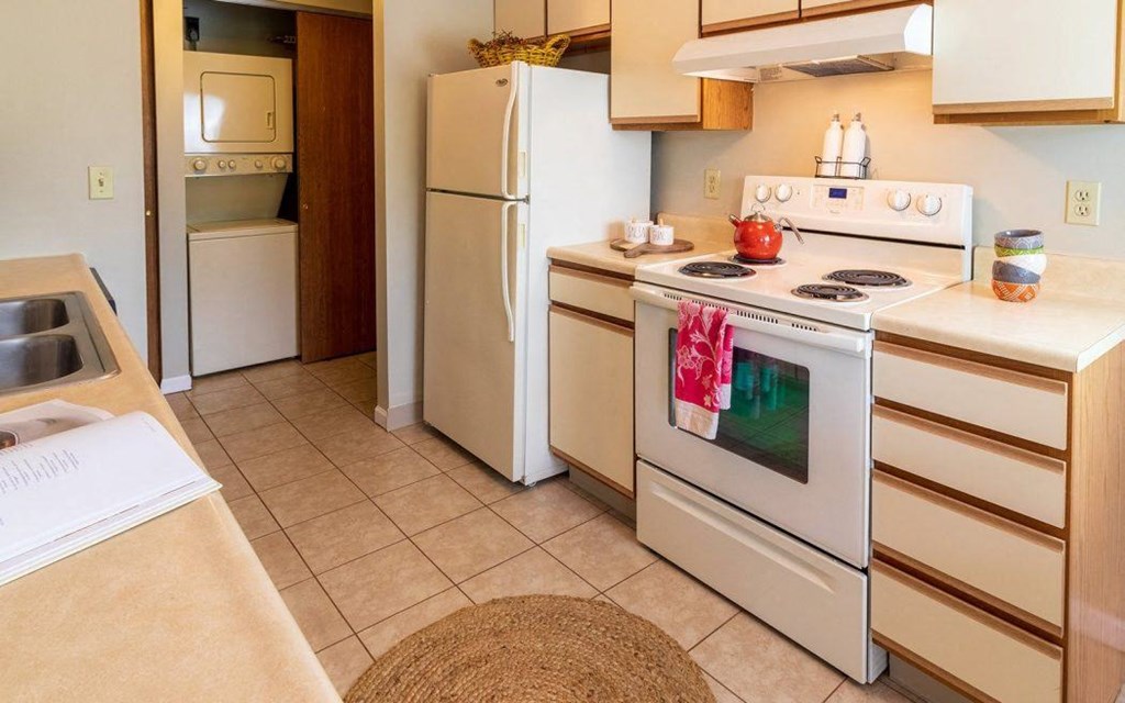 a kitchen with a stove and a refrigerator