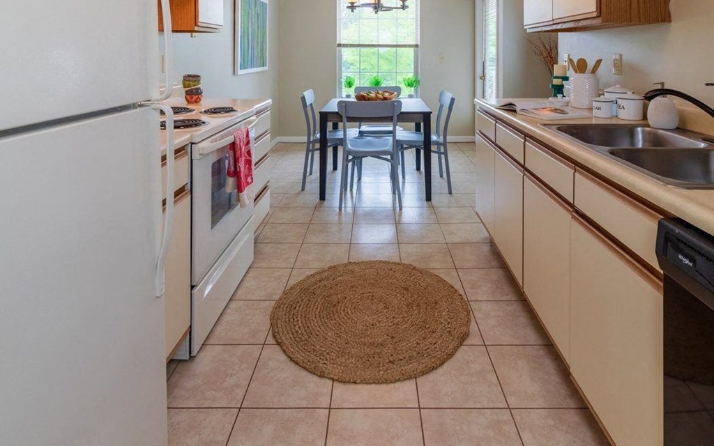 a kitchen with a table and a sink