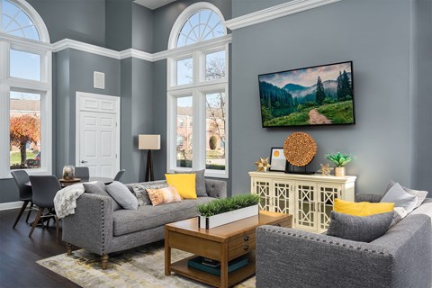 a living room with blue walls and a couch and a table