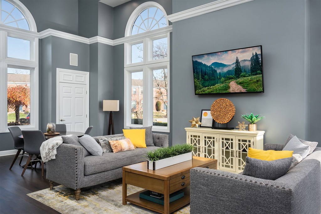 a living room with blue walls and a couch and a table
