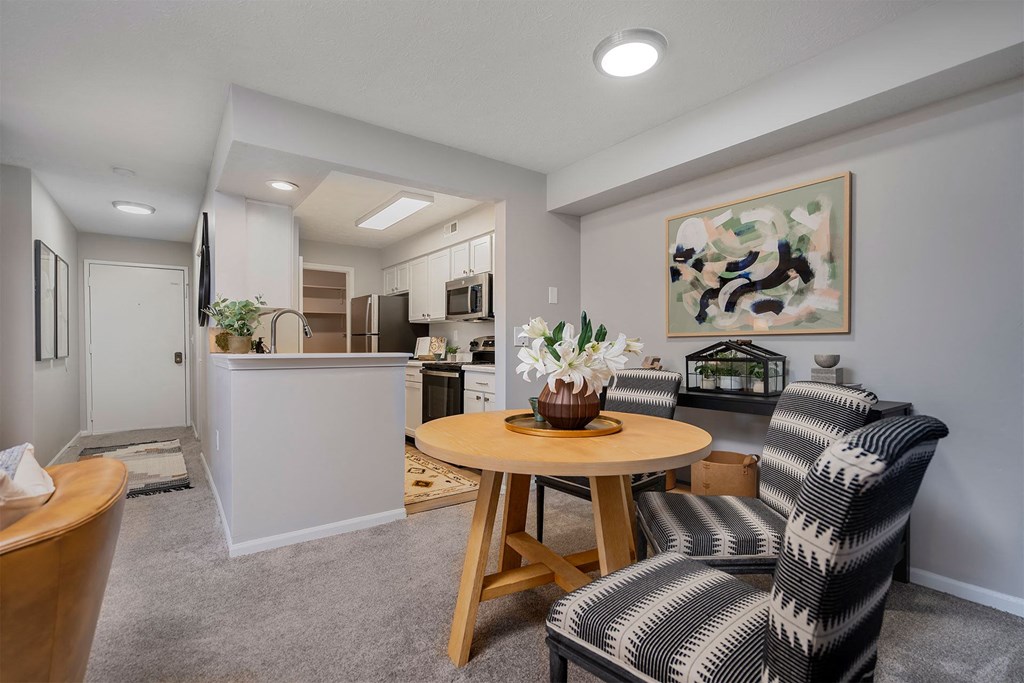 a living room with two chairs and a table