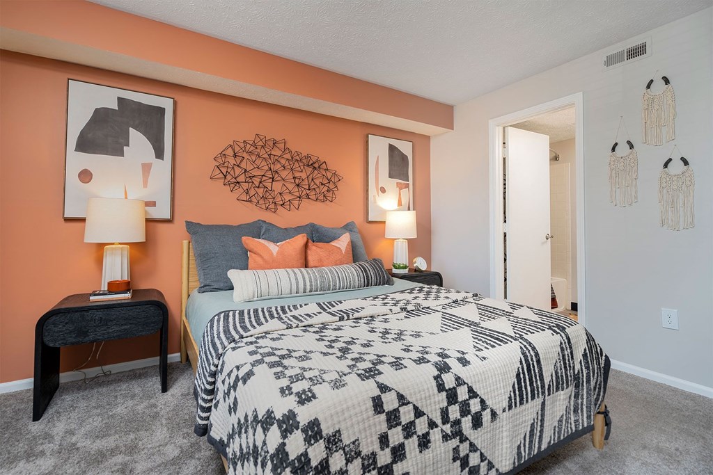 a bedroom with a bed and a closet