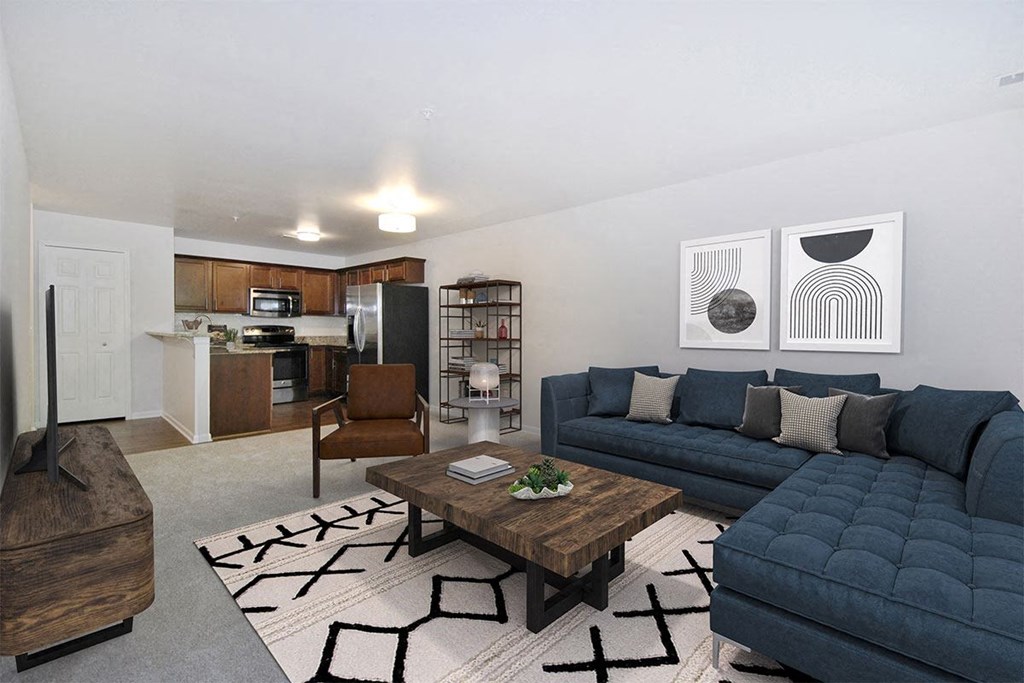 a living room with blue couches and a coffee table