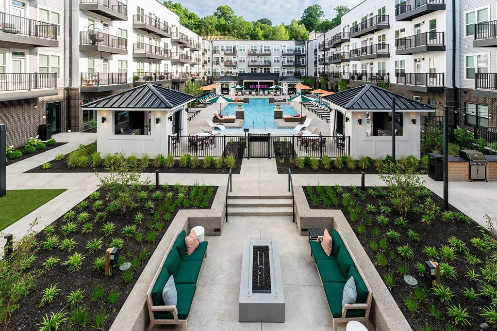 an aerial view of an apartment complex with a swimming pool