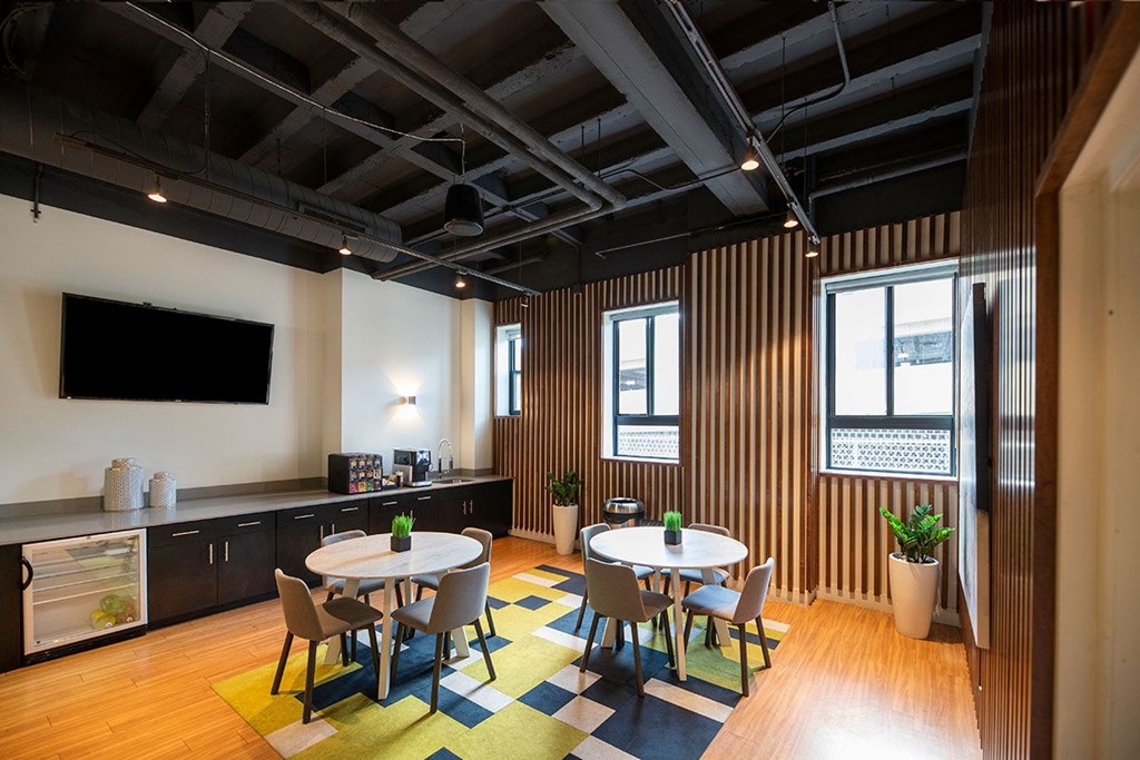 A room with a table and chairs in it.