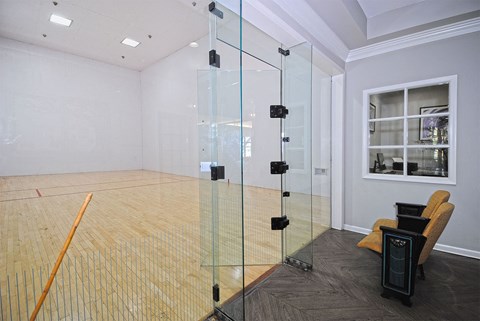 A room with a wooden floor and a glass wall.