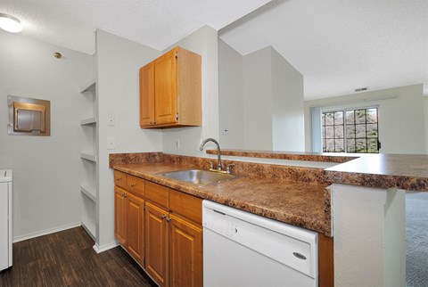 Classic Kitchen with honey oak cabinets and white appliances