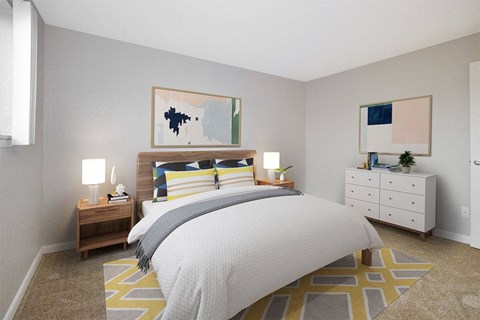 a bedroom with a bed and a dresser