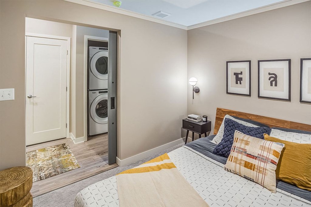 The Asher apartments bedroom and in unit washer and dryer