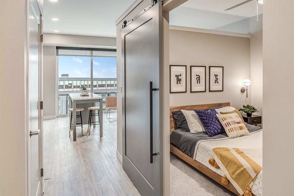 The Asher apartments bedroom with barn door