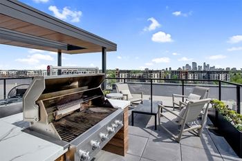 the asher apartments rooftop grilling station