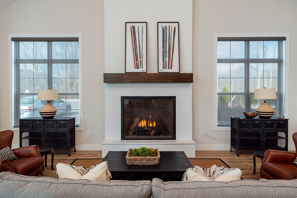 a living room with a couch and a fireplace