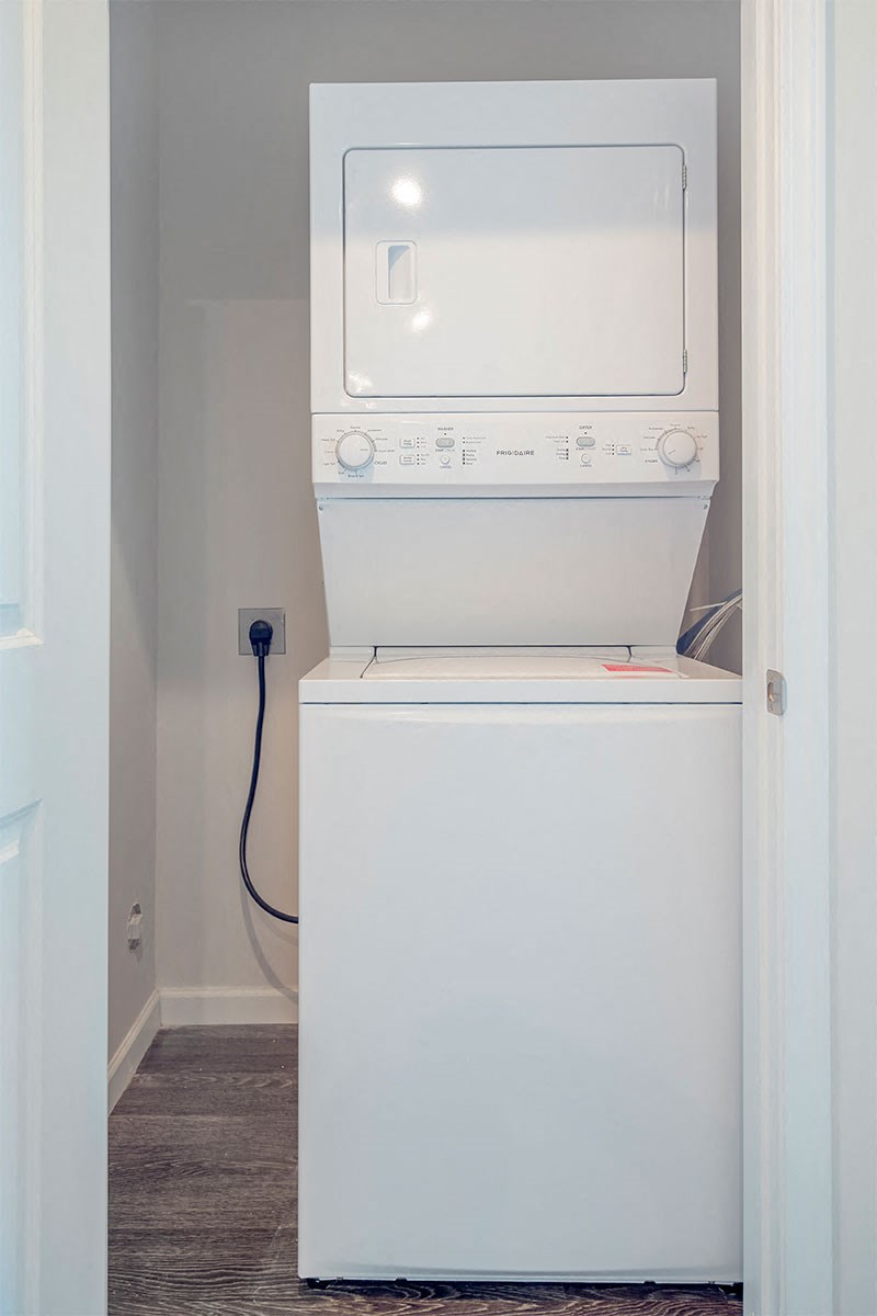 a small laundry room with a washer and dryer