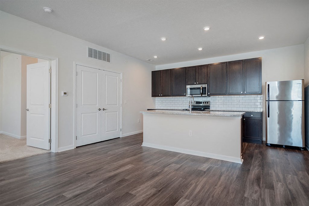 a kitchen with a counter top and a refrigerator