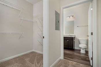 a bathroom with a toilet and a shower and a sink