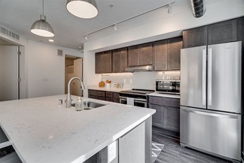 The Donegan Saint Paul Apartments Kitchen with Stainless Steel Appliances