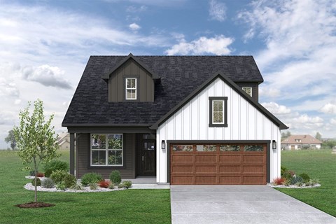 a home with a two story facade and a garage with a garage door