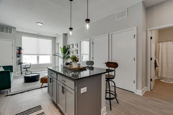 the isaac apartments roseville minnesota kitchen island with granite countertop - Photo Gallery 4