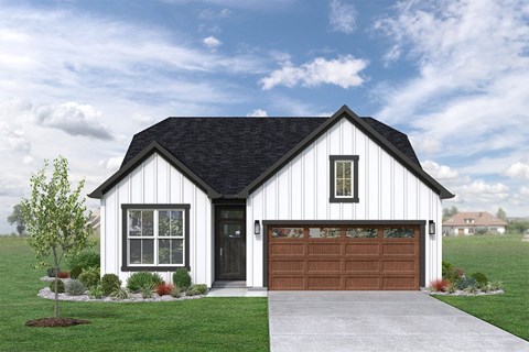 a home with white siding and a brown garage door