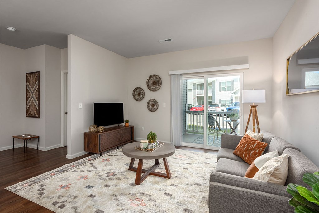 a living room with a couch and a tv
