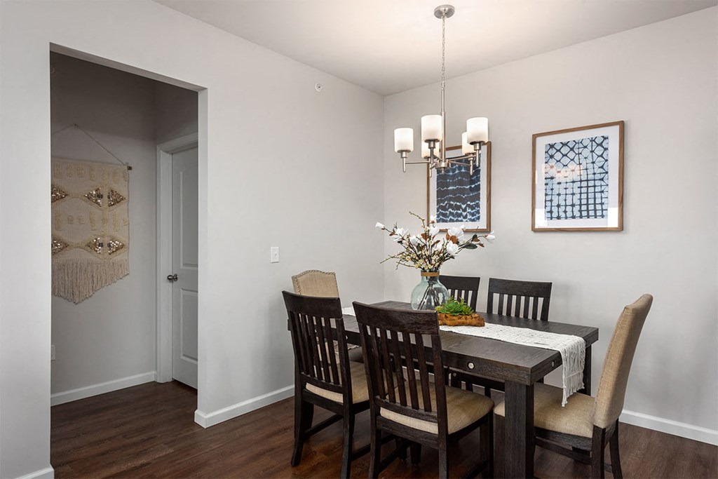 a dining room with a table and chairs