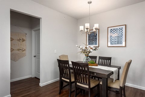 a dining room with a table and chairs