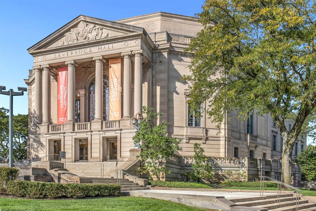 A large, imposing building with a banner that reads "The Severance Hall.".